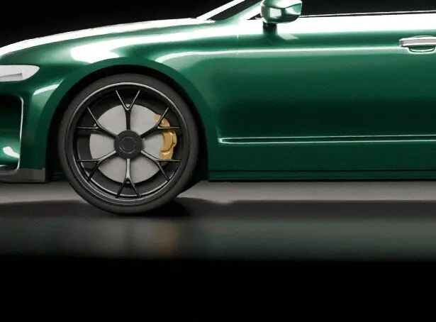 Close view of a front wheel and gold brake caliper on an obsidian green saloon